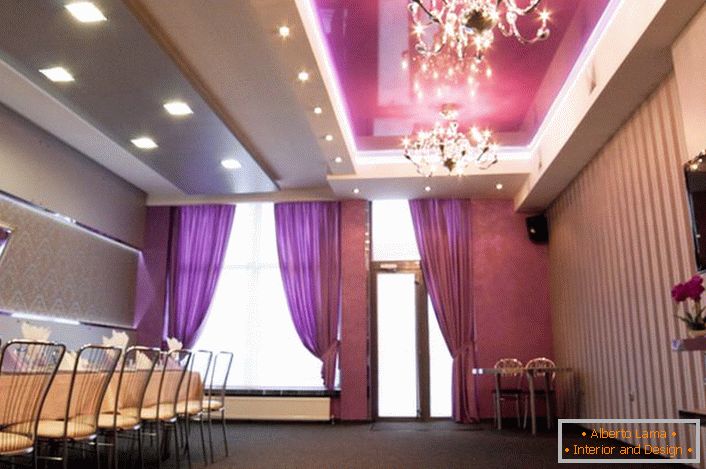 Multistory ceilings harmoniously look with luxurious chandeliers from crystal.