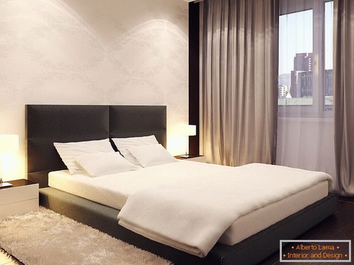 The bed in the minimalist style resembles a low podium. The high soft headboard makes the design softer and smoother.