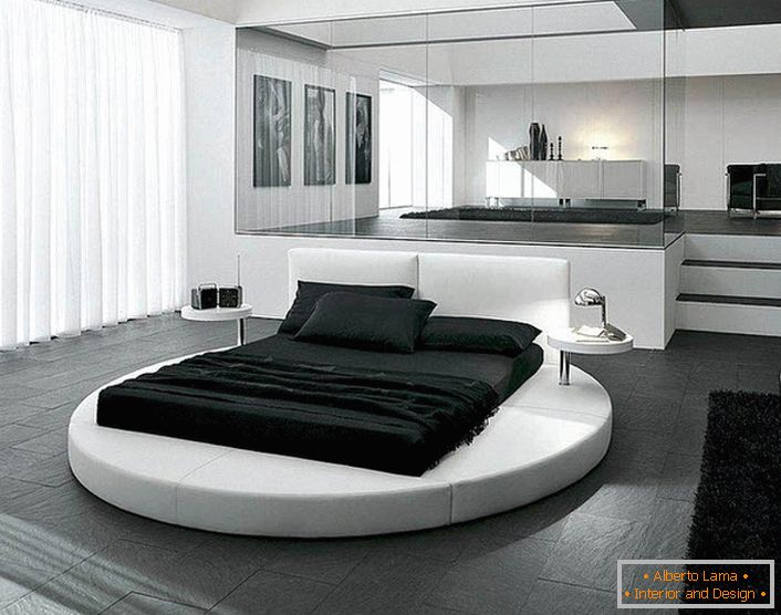 The design of the bedroom in the style of minimalism is emphasized by properly selected furniture. An interesting detail of the interior is a round bed.