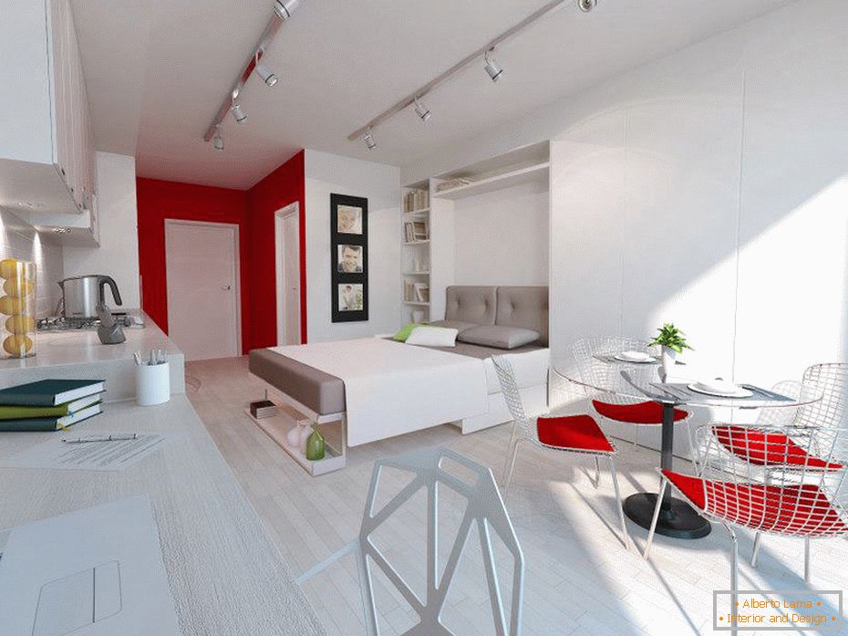 Red accents in a white studio apartment