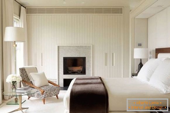 Built-in wardrobes and fireplace in the bedroom