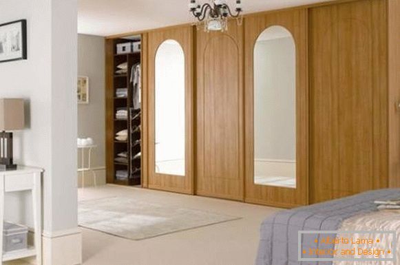 Luxurious closet made of wood in the bedroom