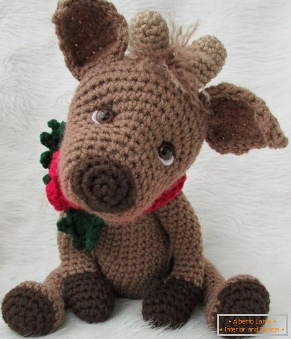 Knitted toy as a gift for the New Year
